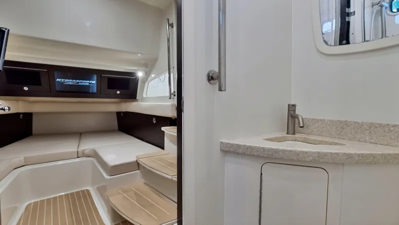 Slide: The Image of Interior cabin of 2018 HCB 53 Sueños boat with seating and sink. - 23