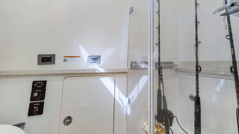 Slide: The Image of Interior of 2018 HCB 53 Sueños boat with fishing rods and control panels. - 25