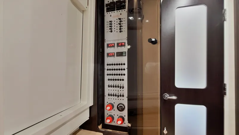 Slide: The Image of Control panel inside 2018 HCB 53 Sueños boat with modern door and sleek design. - 29