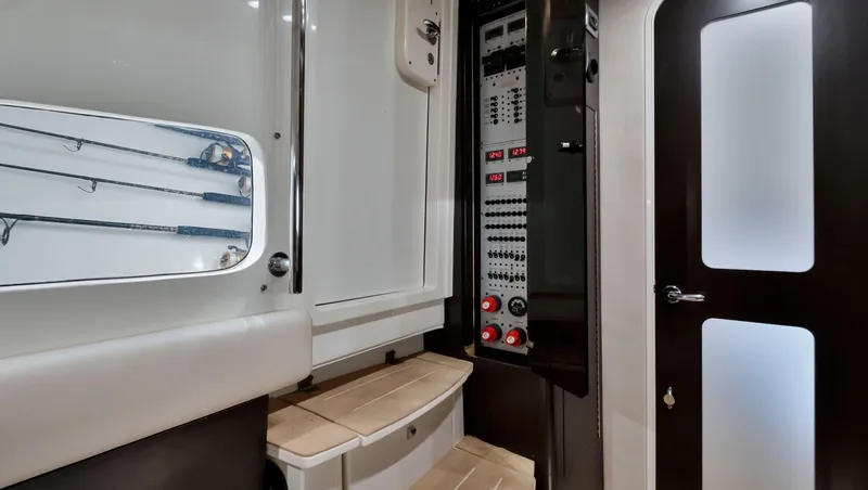 Slide: The Image of Interior control panel of 2018 HCB 53 Sueños boat with seating and storage. - 28