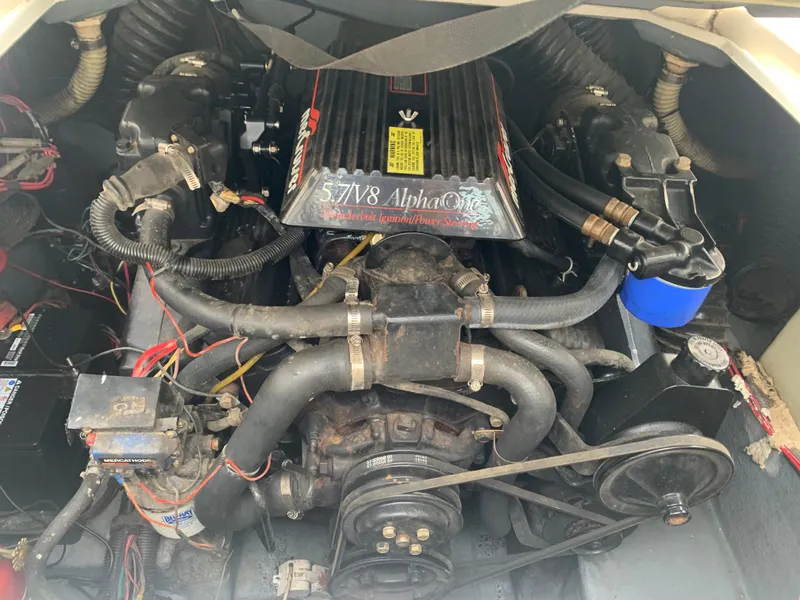 Slide: The Image of 1989 Sea Ray 230 Weekender engine compartment with 5.7L V8 Alpha One engine. - 12