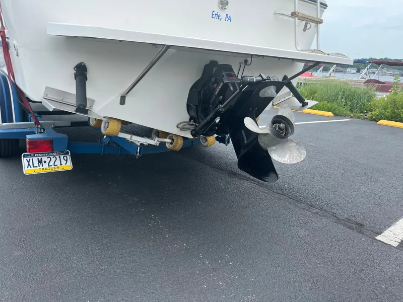 Slide: The Image of 1989 Sea Ray 230 Weekender boat on trailer, rear view with propeller and license plate. - 6