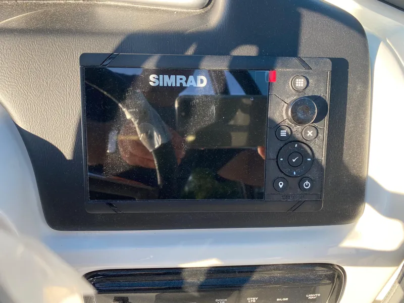 Slide: The Image of Simrad navigation system on 2023 NauticStar 243DC Sport Deck boat. - 3