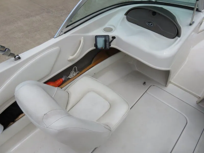 Slide: The Image of Interior of 2006 Sea Ray 175 Sport boat with white seating and dashboard. - 3
