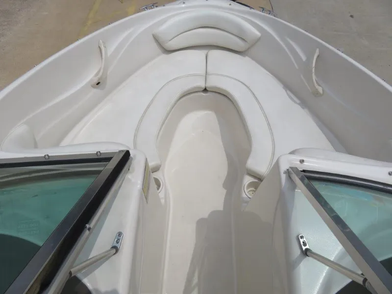 Slide: The Image of 2006 Sea Ray 175 Sport boat interior with white seating and windshield. - 6