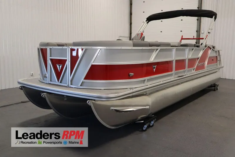 Slide: The Image of 2023 Trifecta 23SB2 SS 3.0 pontoon boat in a showroom with Leaders RPM logo. - 1