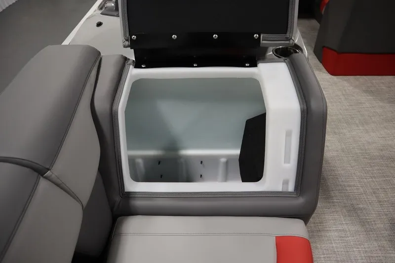Slide: The Image of Open storage compartment in 2023 Trifecta 23SB2 SS 3.0 boat with gray and red seating. - 12