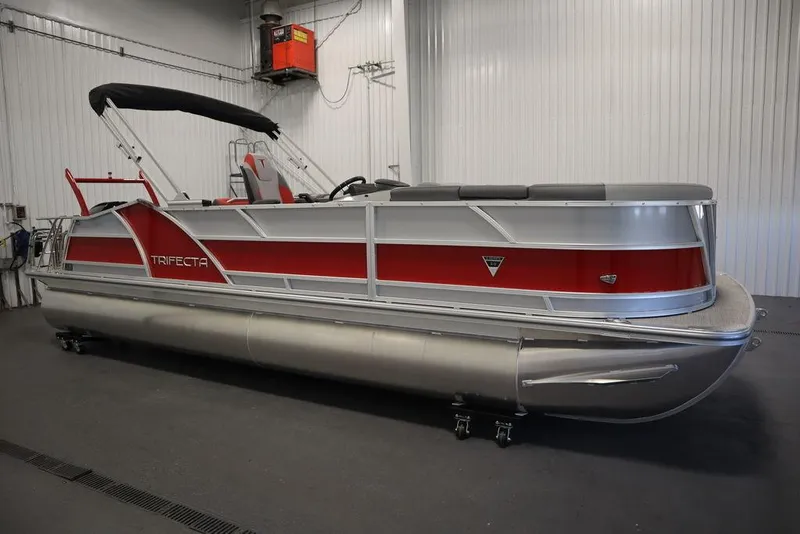 Slide: The Image of 2023 Trifecta 23SB2 SS 3.0 pontoon boat in a showroom. - 24
