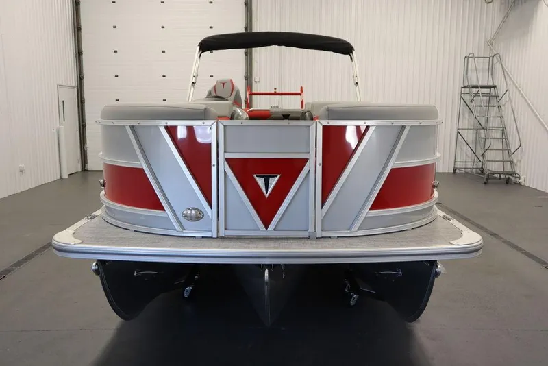 Slide: The Image of 2023 Trifecta 23SB2 SS 3.0 pontoon boat in a showroom. - 3