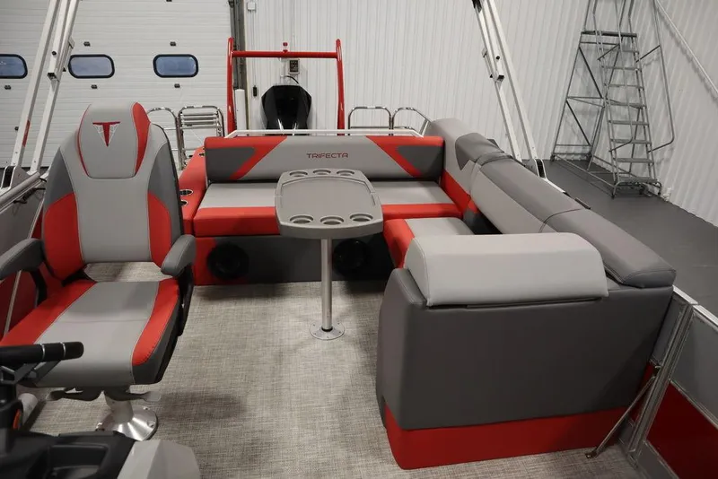 Slide: The Image of 2023 Trifecta 23SB2 SS 3.0 pontoon boat interior with red and gray seating. - 34