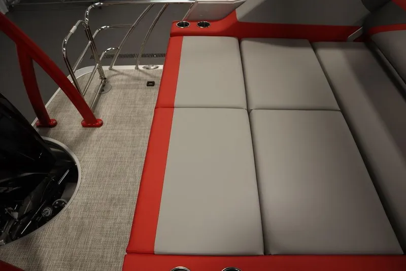 Slide: The Image of 2023 Trifecta 23SB2 SS 3.0 boat interior with red and gray seating. - 44