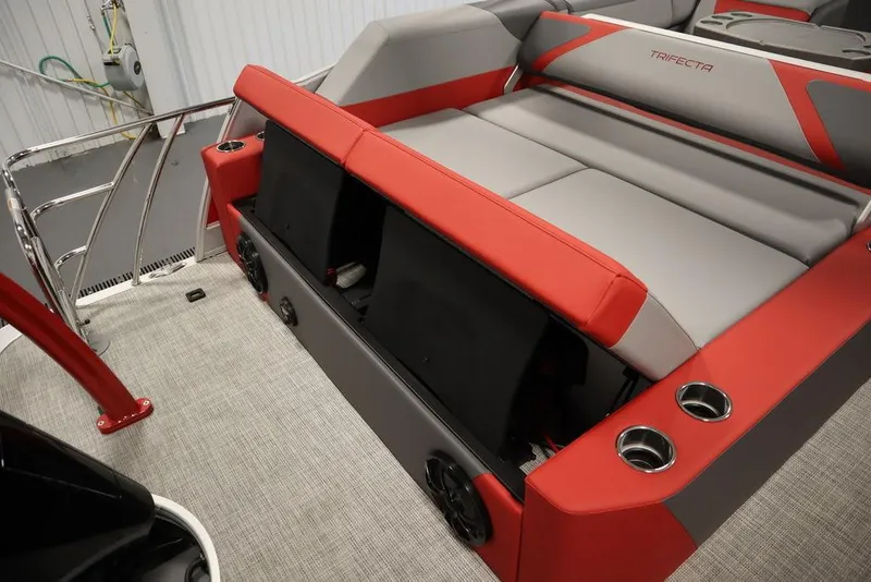 Slide: The Image of 2023 Trifecta 23SB2 SS 3.0 boat interior with red and gray seating. - 49