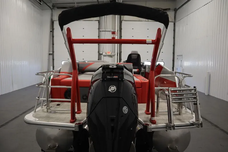 Slide: The Image of 2023 Trifecta 23SB2 SS 3.0 pontoon boat in a storage facility. - 6