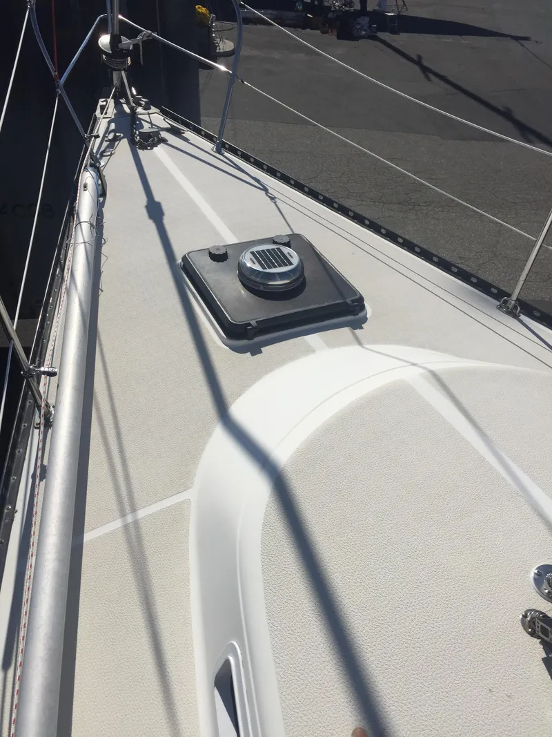 Slide: The Image of 1980 Tartan 33 sailboat deck with hatch and rigging. - 1