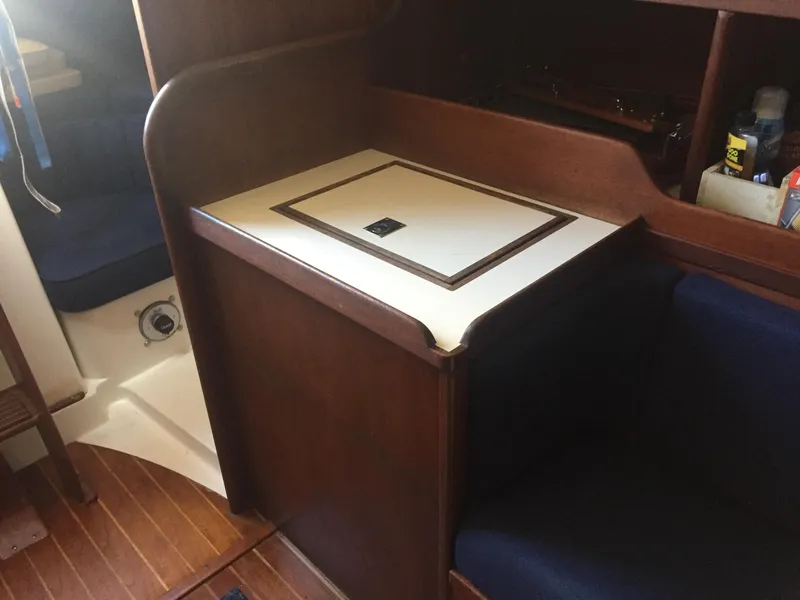 Slide: The Image of Interior of 1980 Tartan 33 sailboat with wooden cabinetry and seating. - 18