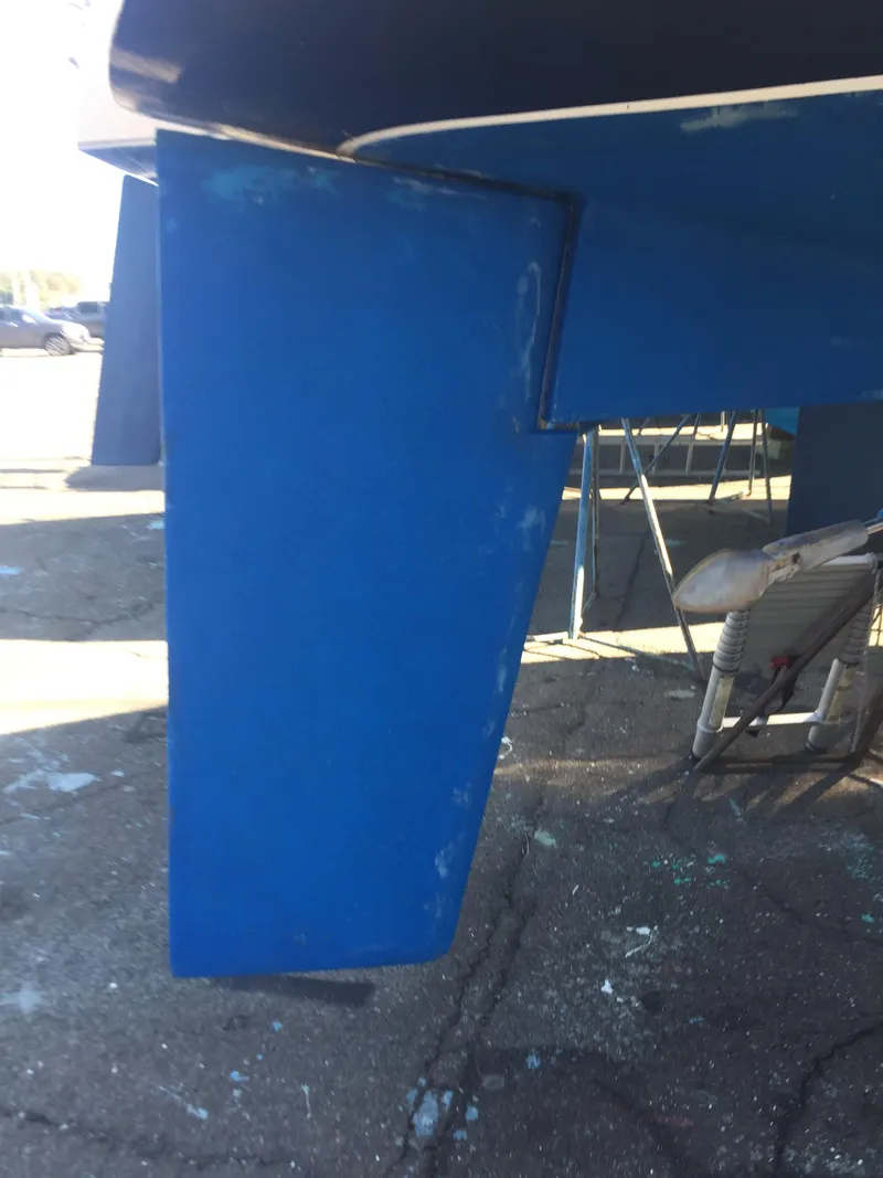 Slide: The Image of 1980 Tartan 33 sailboat keel in dry dock. - 26