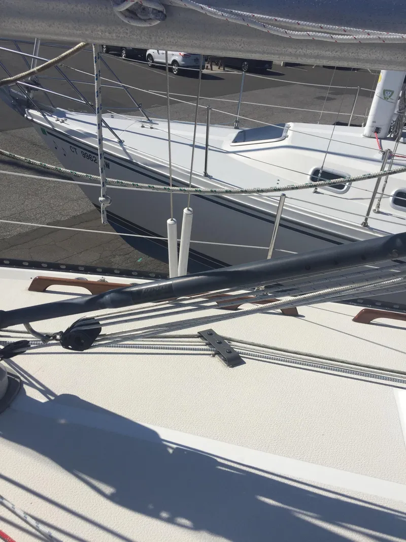 Slide: The Image of 1980 Tartan 33 sailboat docked at a marina. - 4