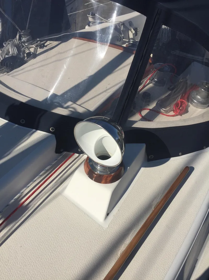 Slide: The Image of 1980 Tartan 33 sailboat cockpit with compass and navigation equipment. - 8