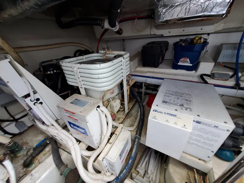 Slide: The Image of Engine room of a 2003 Carver 570 Voyager Pilothouse yacht with various equipment. - 21