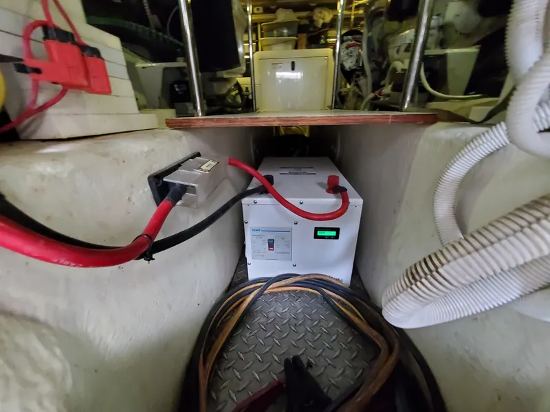 Slide: The Image of Engine room of a 2003 Carver 570 Voyager Pilothouse with electrical components. - 25