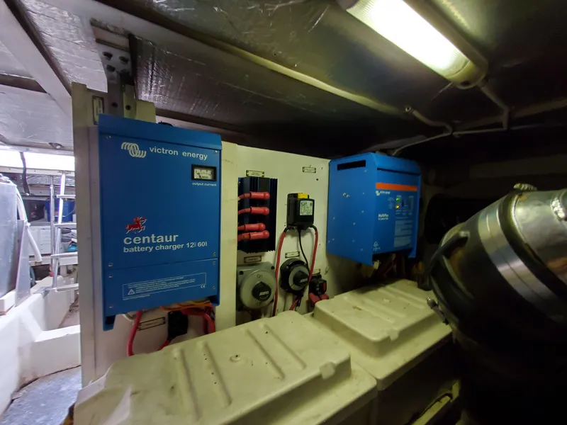 Slide: The Image of Engine room of 2003 Carver 570 Voyager Pilothouse with Victron Energy battery chargers. - 28