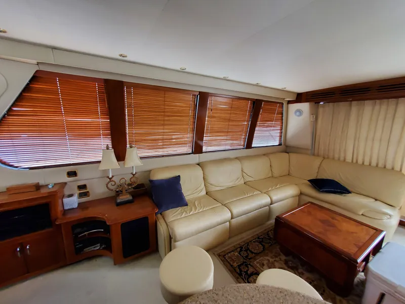Slide: The Image of Luxurious interior of 2003 Carver 570 Voyager Pilothouse with leather seating and wooden accents. - 36