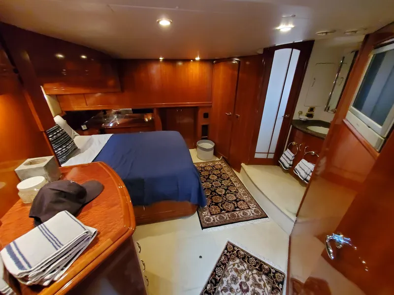 Slide: The Image of Luxurious cabin interior of a 2003 Carver 570 Voyager Pilothouse yacht. - 40