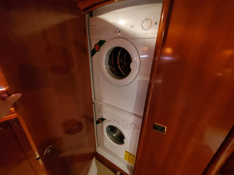 Slide: The Image of Stacked washer and dryer in 2003 Carver 570 Voyager Pilothouse yacht. - 42