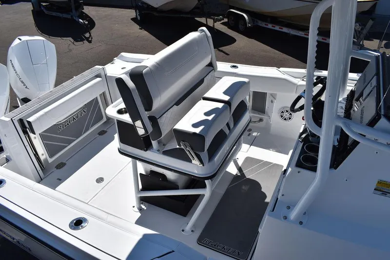 Slide: The Image of 2023 Blackfin 252CC boat interior with seating and console. - 11