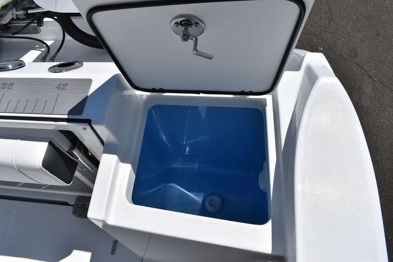 Slide: The Image of 2023 Blackfin 252CC boat with open storage compartment. - 15