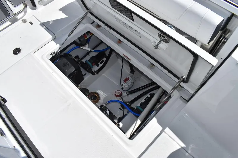 Slide: The Image of 2023 Blackfin 252CC boat storage compartment with open hatch. - 17