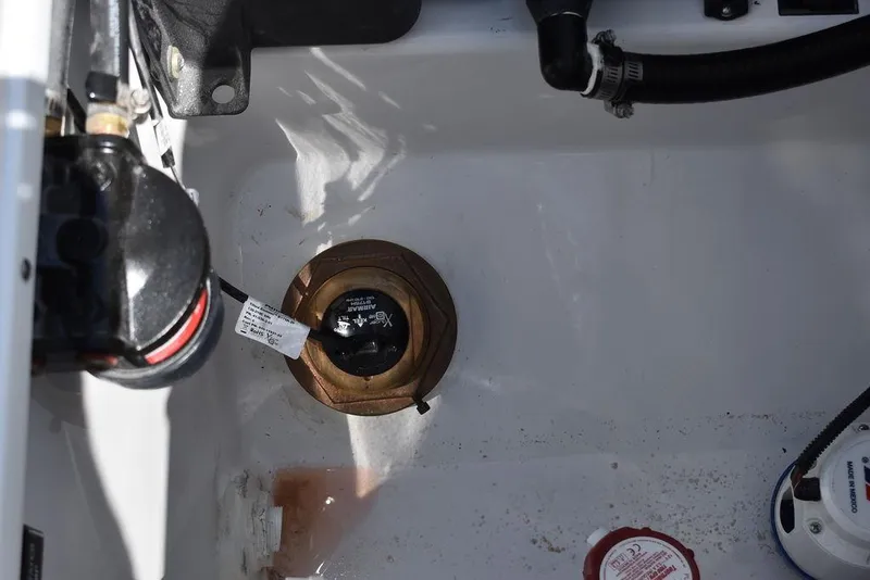 Slide: The Image of 2023 Blackfin 252CC boat bilge area with pump and wiring. - 18