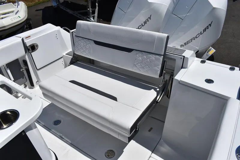 Slide: The Image of 2023 Blackfin 252CC boat with foldable rear bench seat and twin Mercury engines. - 20