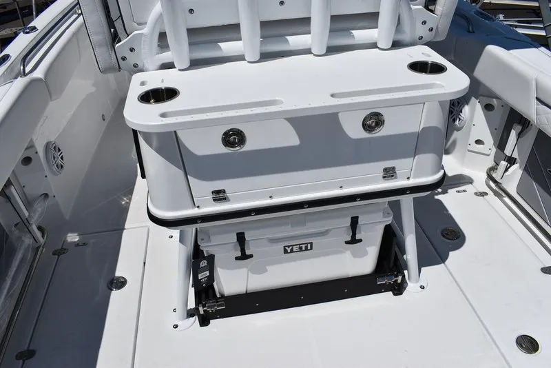 Slide: The Image of 2023 Blackfin 252CC boat interior with Yeti cooler and storage compartments. - 21