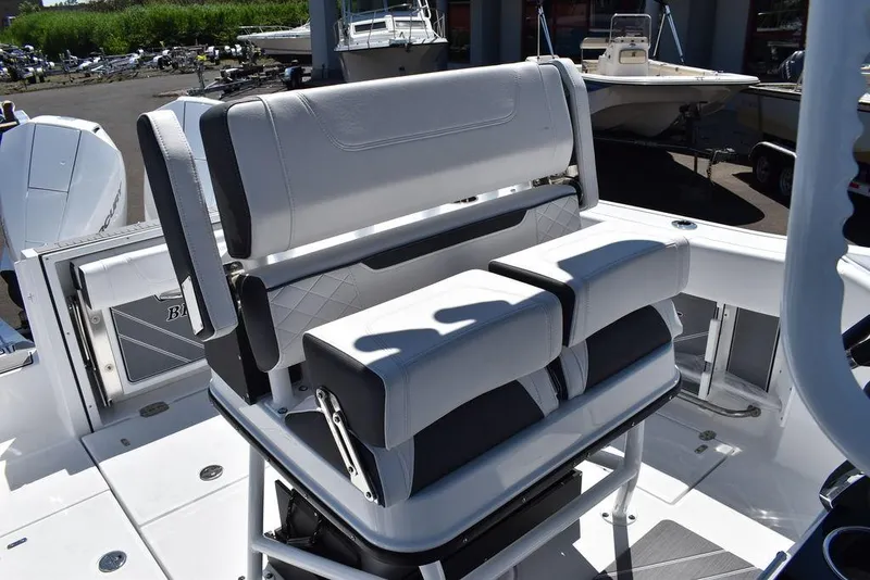 Slide: The Image of 2023 Blackfin 252CC boat with white and black seating in the cockpit area. - 28