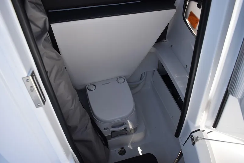 Slide: The Image of 2023 Blackfin 252CC boat interior with compact marine toilet. - 42
