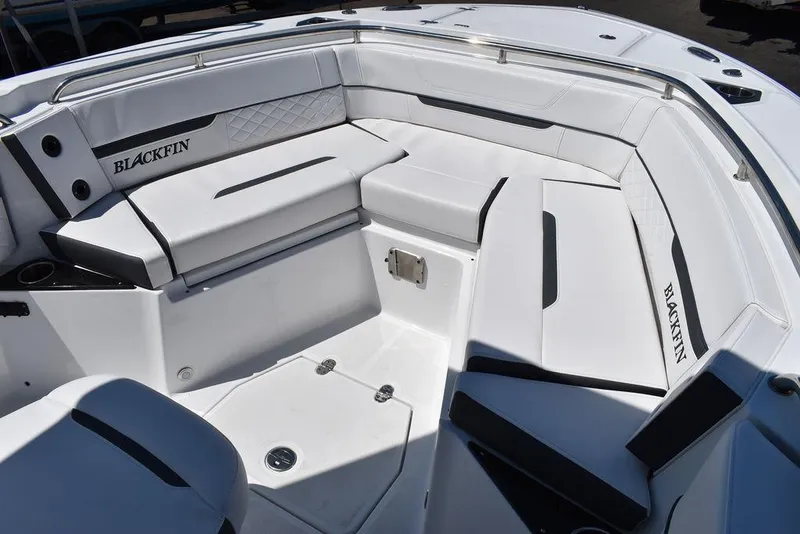 Slide: The Image of 2023 Blackfin 252CC boat interior with white cushioned seating. - 43