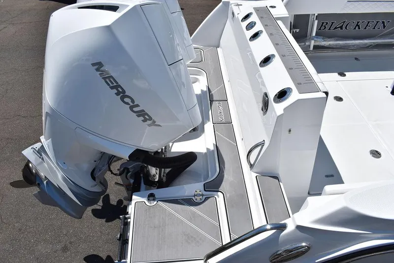 Slide: The Image of 2023 Blackfin 252CC boat with Mercury outboard engine, rear deck view. - 6