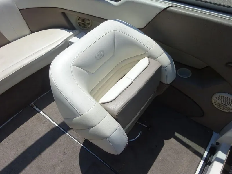 Slide: The Image of 1999 Cobalt 253 boat interior with white and gray seating. - 11