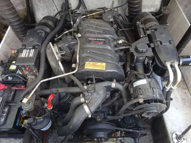 Slide: The Image of 1999 Cobalt 253 boat engine compartment with Volvo Penta 7.4L engine. - 17
