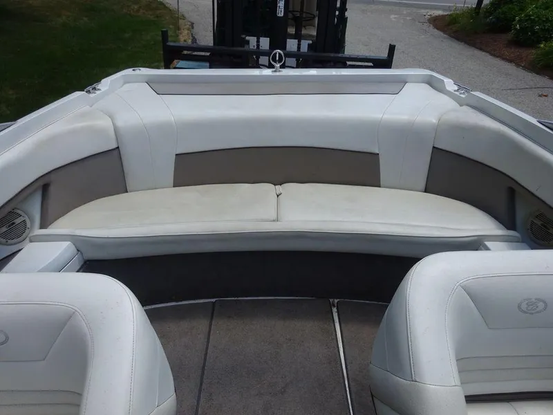 Slide: The Image of 1999 Cobalt 253 boat interior with white and gray seating. - 20