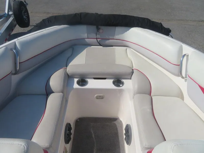 Slide: The Image of 2012 Bryant 246 boat interior with white and gray seating. - 1