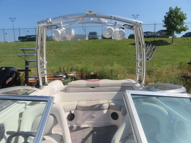 Slide: The Image of 2012 Bryant 246 boat interior with wakeboard tower and speakers. - 14