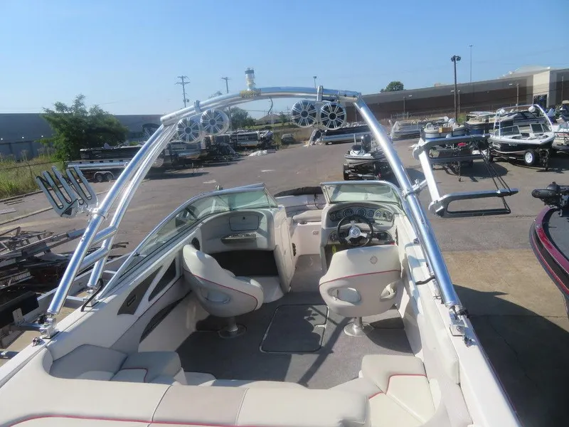 Slide: The Image of 2012 Bryant 246 boat interior with wakeboard tower and speakers. - 7