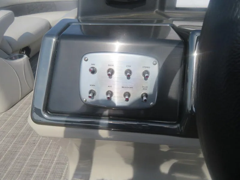 Slide: The Image of Control panel of a 2020 Xcursion 245 Sport Toon boat. - 11