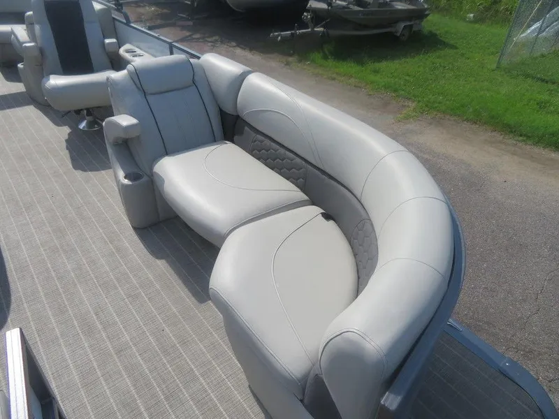 Slide: The Image of 2020 Xcursion 245 Sport Toon boat interior with gray seating and carpet. - 17