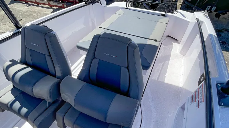 Slide: The Image of 2023 Axopar 22 T-Top boat interior with dual seats and sunbed. - 12