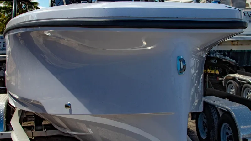 Slide: The Image of 2023 Axopar 22 T-Top boat on a trailer, side view. - 16
