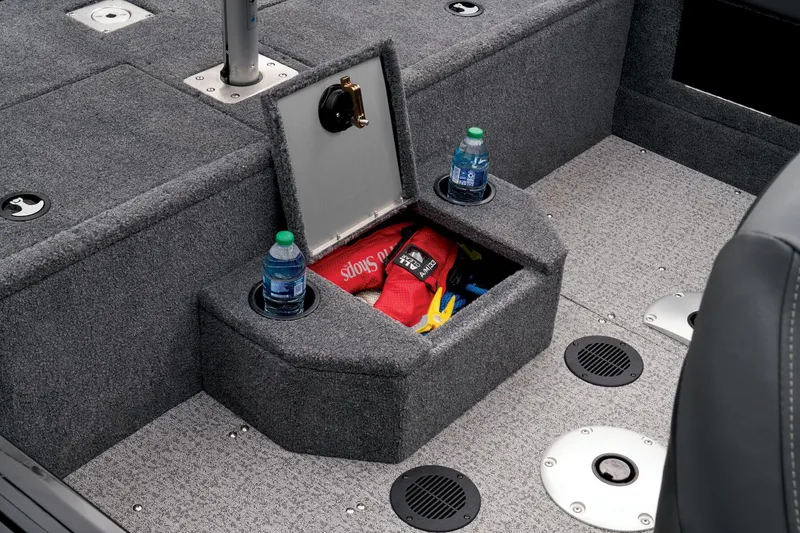 Slide: The Image of 2023 Tracker Targa V-19 WT boat interior storage compartment with cup holders. - 27
