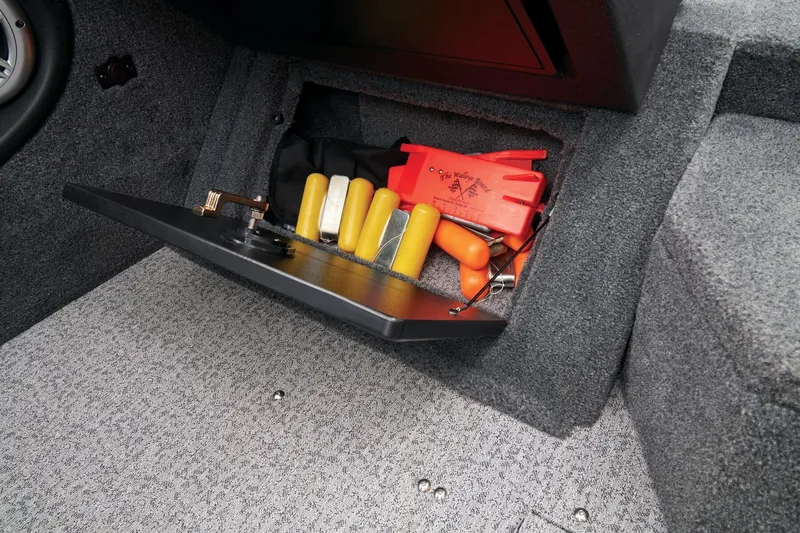 Slide: The Image of 2023 Tracker Targa V-19 WT storage compartment with safety equipment. - 45